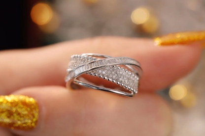 18k gold ring set with a natural diamond; the diamond features a Tapered Baguette cut and weighs 0.55carats.