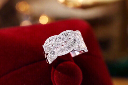 18k gold ring set with a natural diamond; the diamond features a Tapered Baguette cut and weighs 0.65carats.