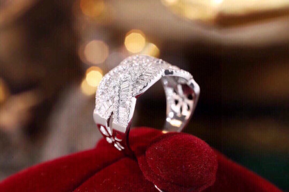 18k gold ring set with a natural diamond; the diamond features a Tapered Baguette cut and weighs 0.65carats.