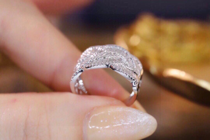 18k gold ring set with a natural diamond; the diamond features a Tapered Baguette cut and weighs 0.65carats.