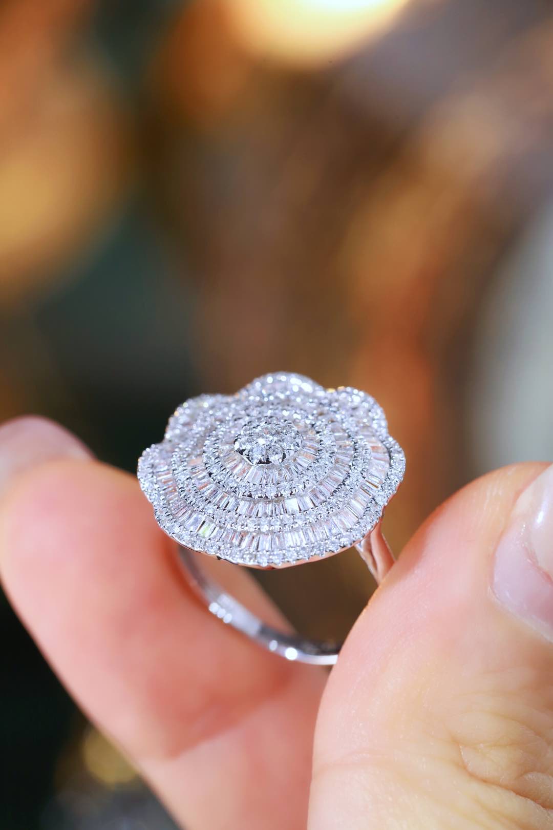 18k gold ring set with a natural diamond; the diamond features a Tapered Baguette cut and weighs 1.50carats.