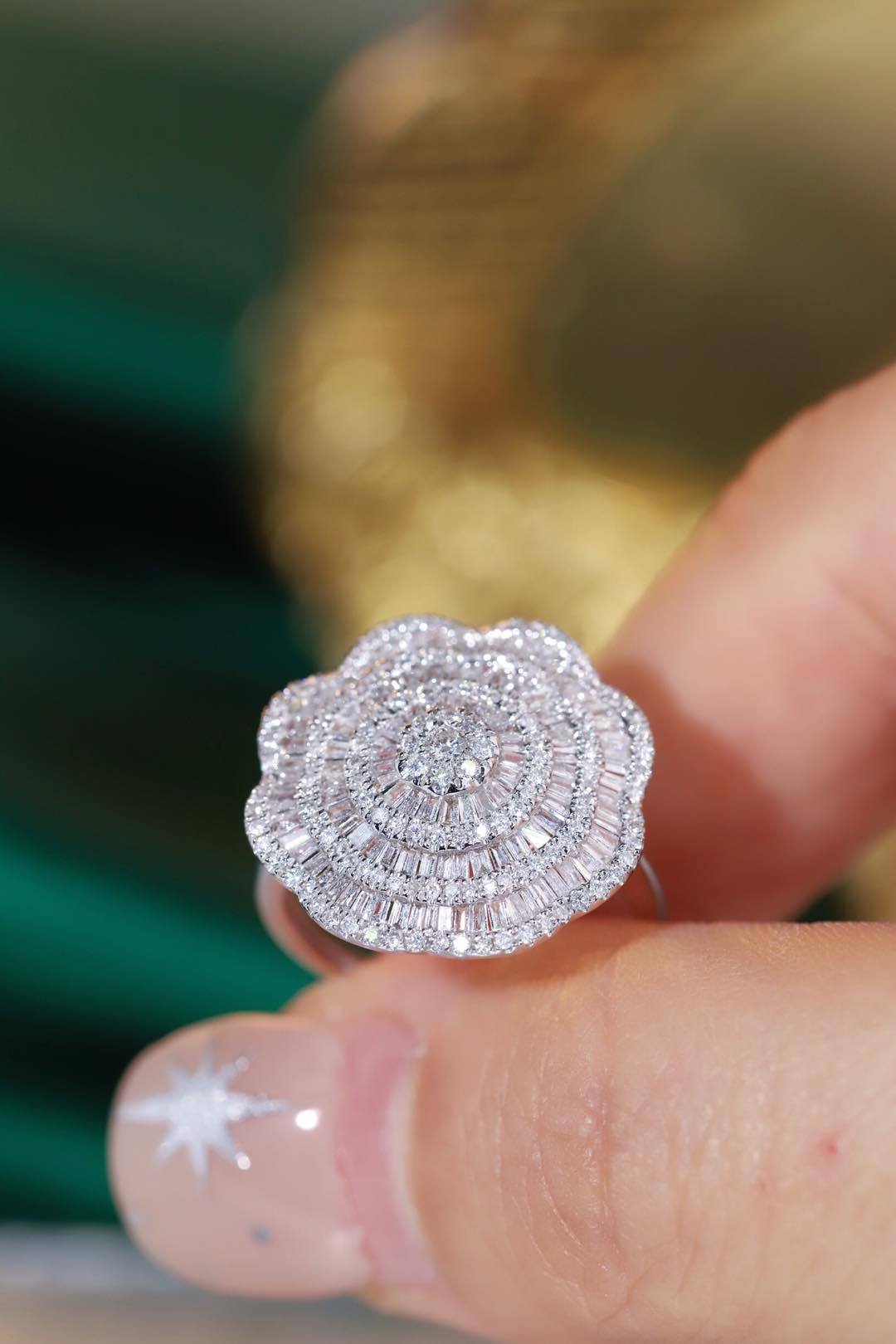 18k gold ring set with a natural diamond; the diamond features a Tapered Baguette cut and weighs 1.50carats.