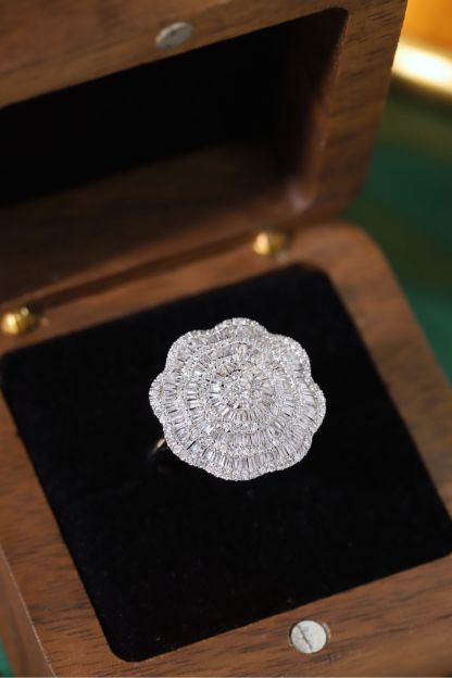 18k gold ring set with a natural diamond; the diamond features a Tapered Baguette cut and weighs 1.50carats.