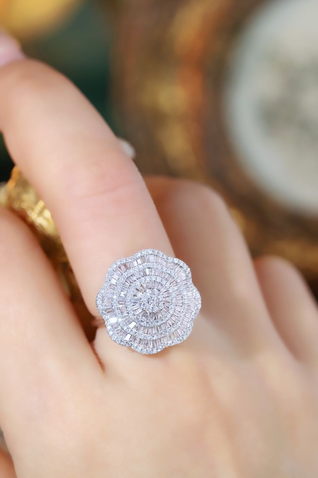 18k gold ring set with a natural diamond; the diamond features a Tapered Baguette cut and weighs 1.50carats.