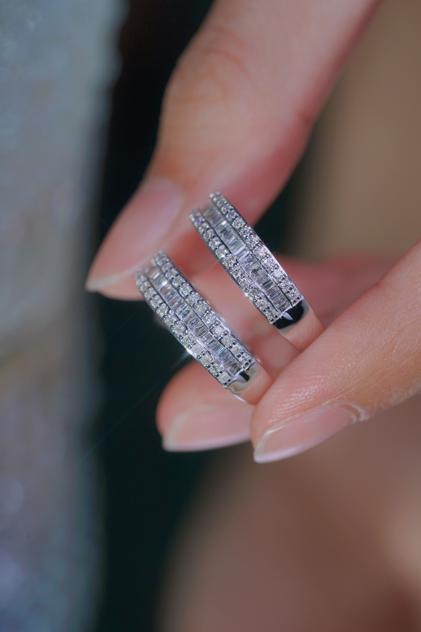 18k gold ring set with a natural diamond; the diamond features a Tapered Baguette cut and weighs 0.50 carats.