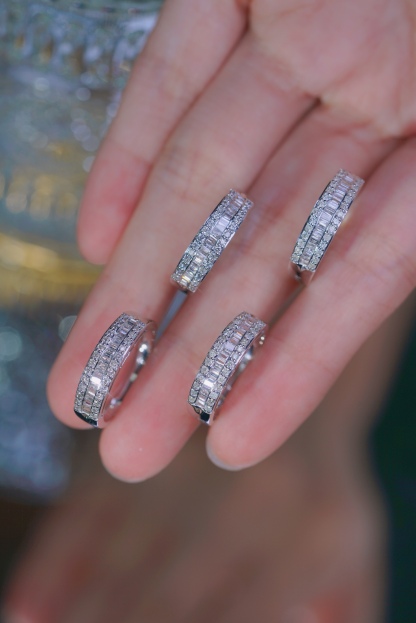 18k gold ring set with a natural diamond; the diamond features a Tapered Baguette cut and weighs 0.50 carats.