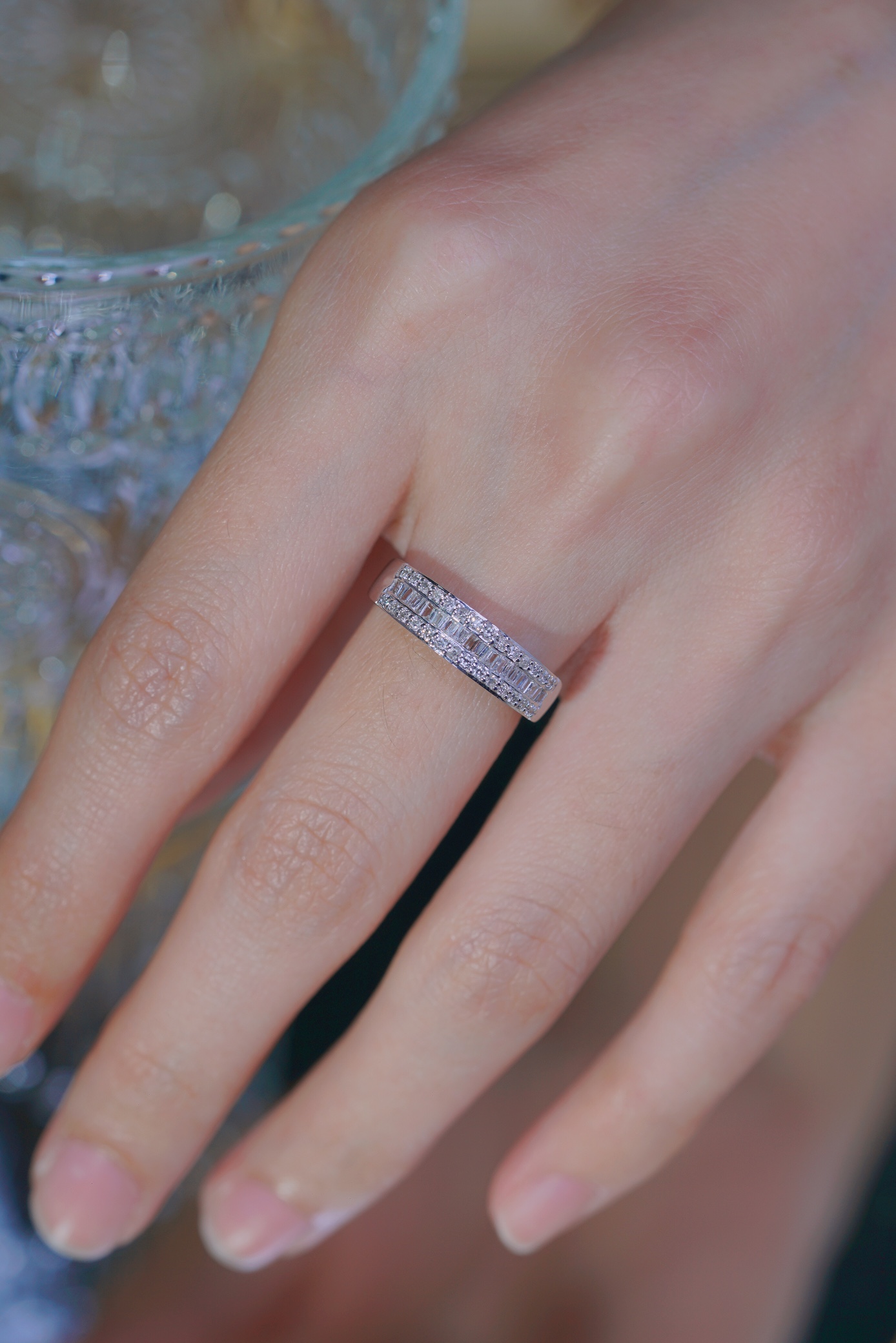 18k gold ring set with a natural diamond; the diamond features a Tapered Baguette cut and weighs 0.50 carats.