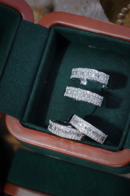 18k gold ring set with a natural diamond; the diamond features a Tapered Baguette cut and weighs 0.50 carats.