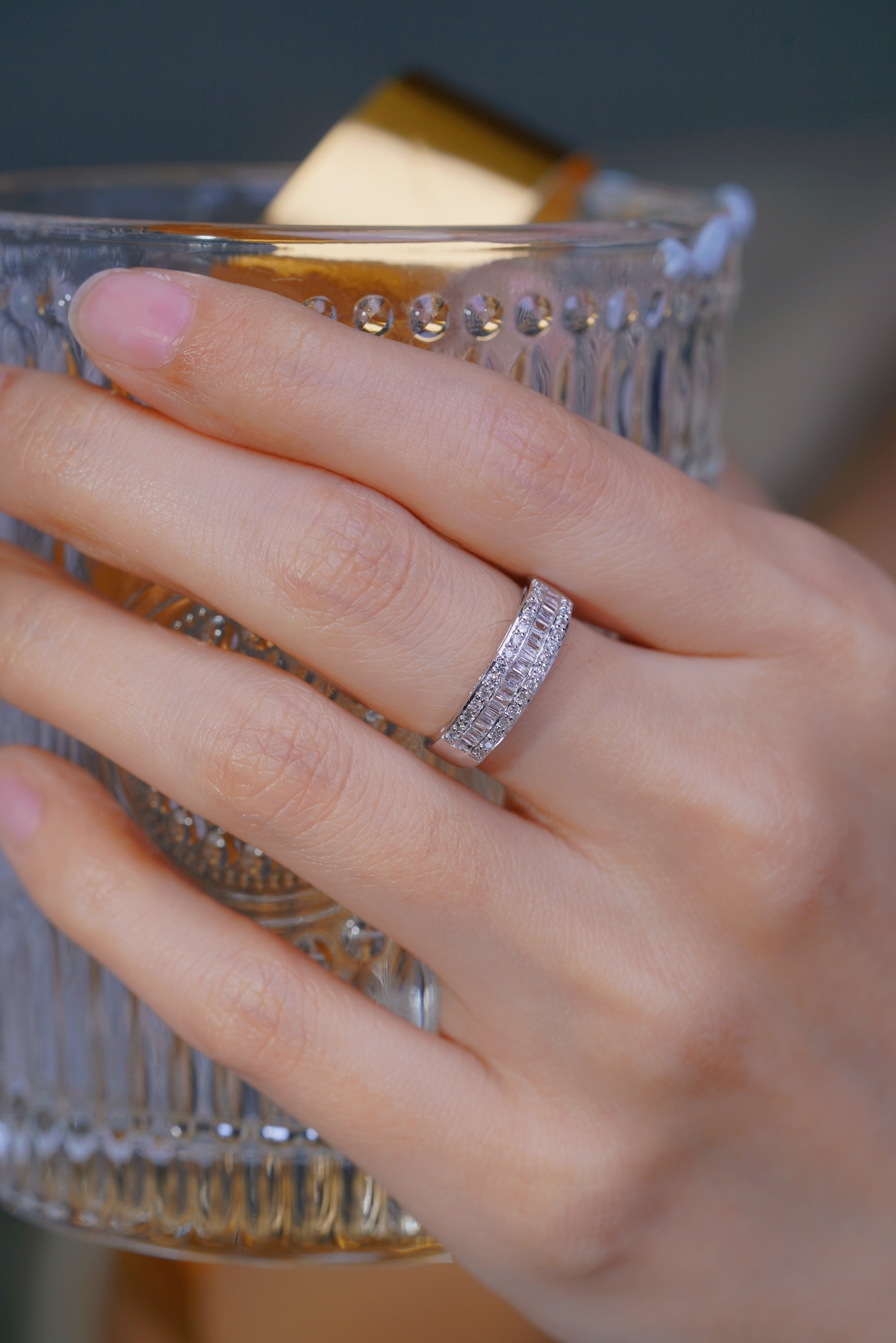 18k gold ring set with a natural diamond; the diamond features a Tapered Baguette cut and weighs 0.50 carats.