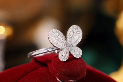 18k gold ring set with a natural diamond; the diamond features a Tapered Baguette cut and weighs 0.40 carats.