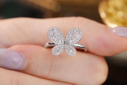 18k gold ring set with a natural diamond; the diamond features a Tapered Baguette cut and weighs 0.40 carats.