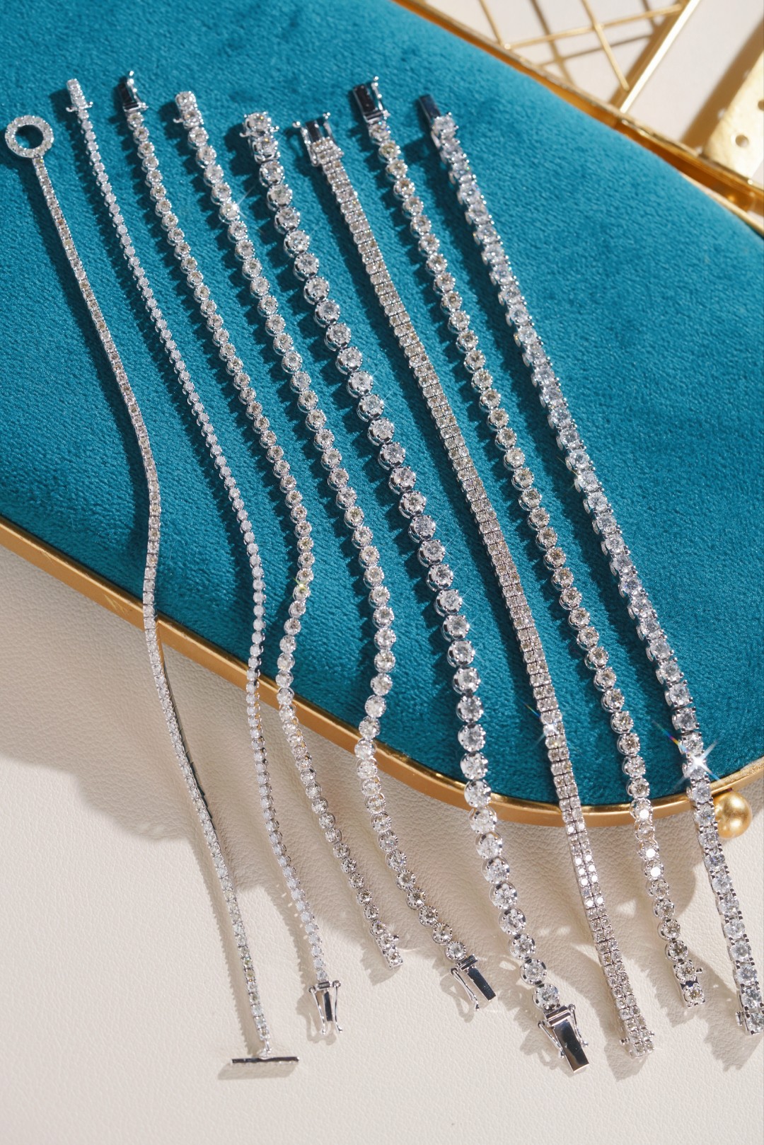 18k gold bracelet with natural diamonds; available in sizes of 1ct and 2ct; designed as a tennis bracelet.