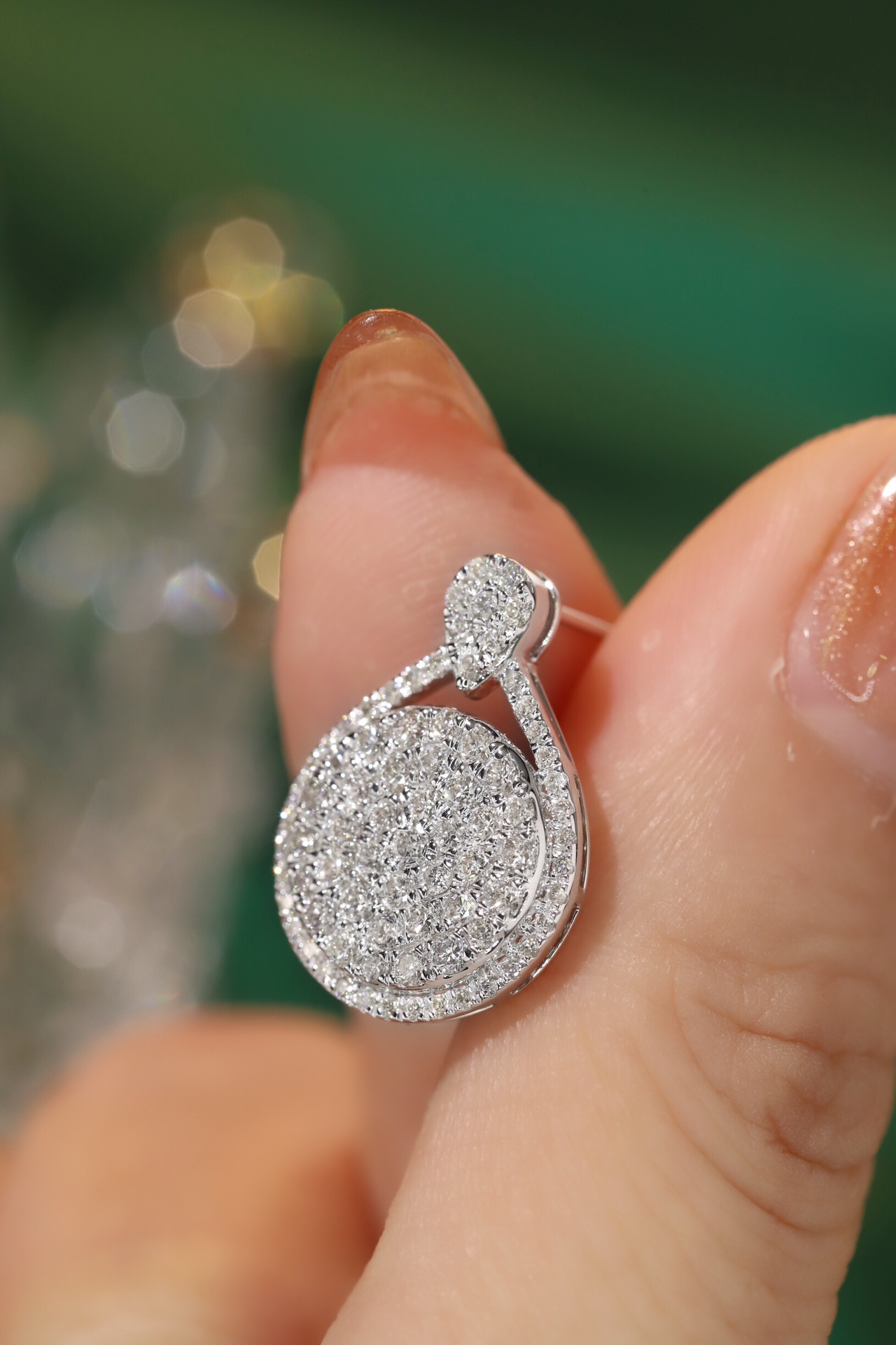 18k gold earrings set with a 2.00-carat natural diamond
