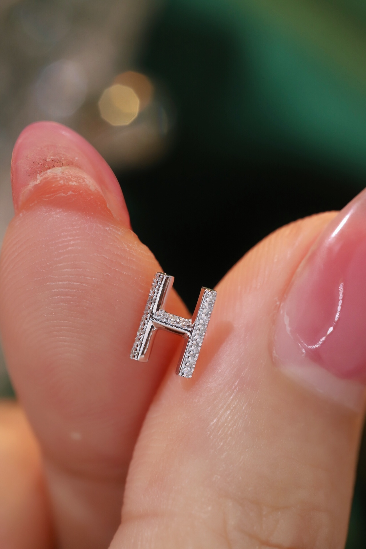 18k gold earring stud with the letter “H” and a 0.08ct natural diamond inlaid.