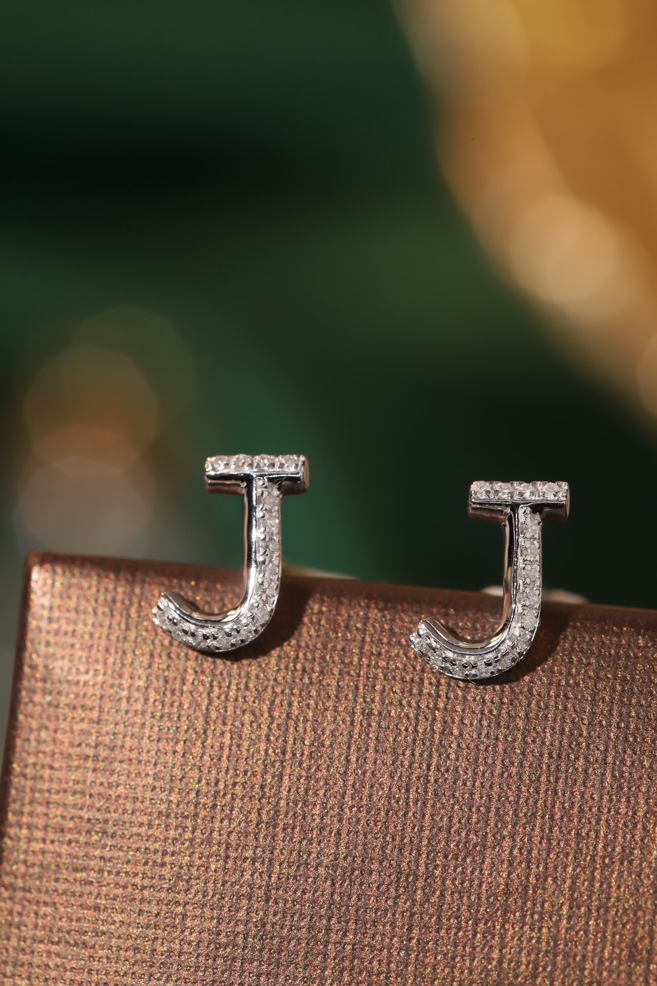18k gold earring stud with the letter “J” and a 0.08ct natural diamond inlaid.