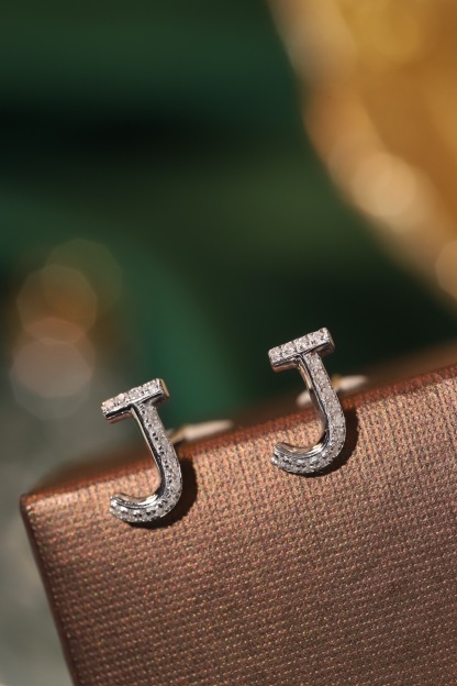18k gold earring stud with the letter “J” and a 0.08ct natural diamond inlaid.