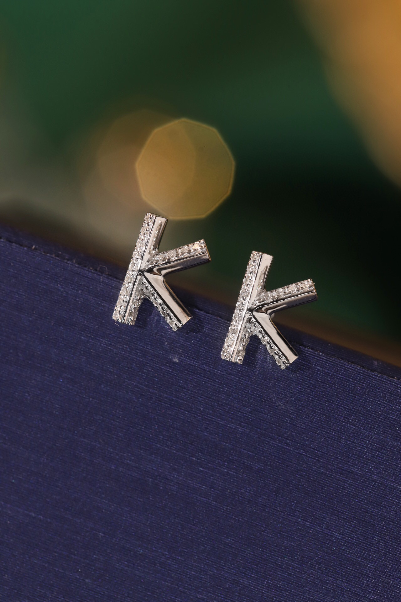 18k gold earring stud with the letter “K” and a 0.08ct natural diamond inlaid.
