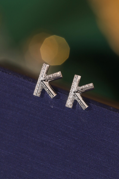 18k gold earring stud with the letter “K” and a 0.08ct natural diamond inlaid.