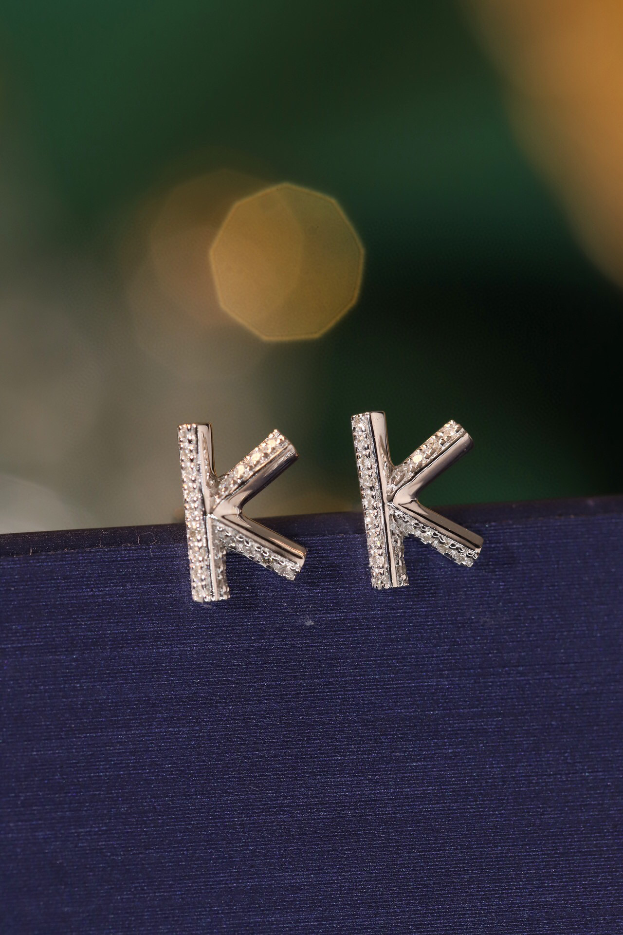 18k gold earring stud with the letter “K” and a 0.08ct natural diamond inlaid.