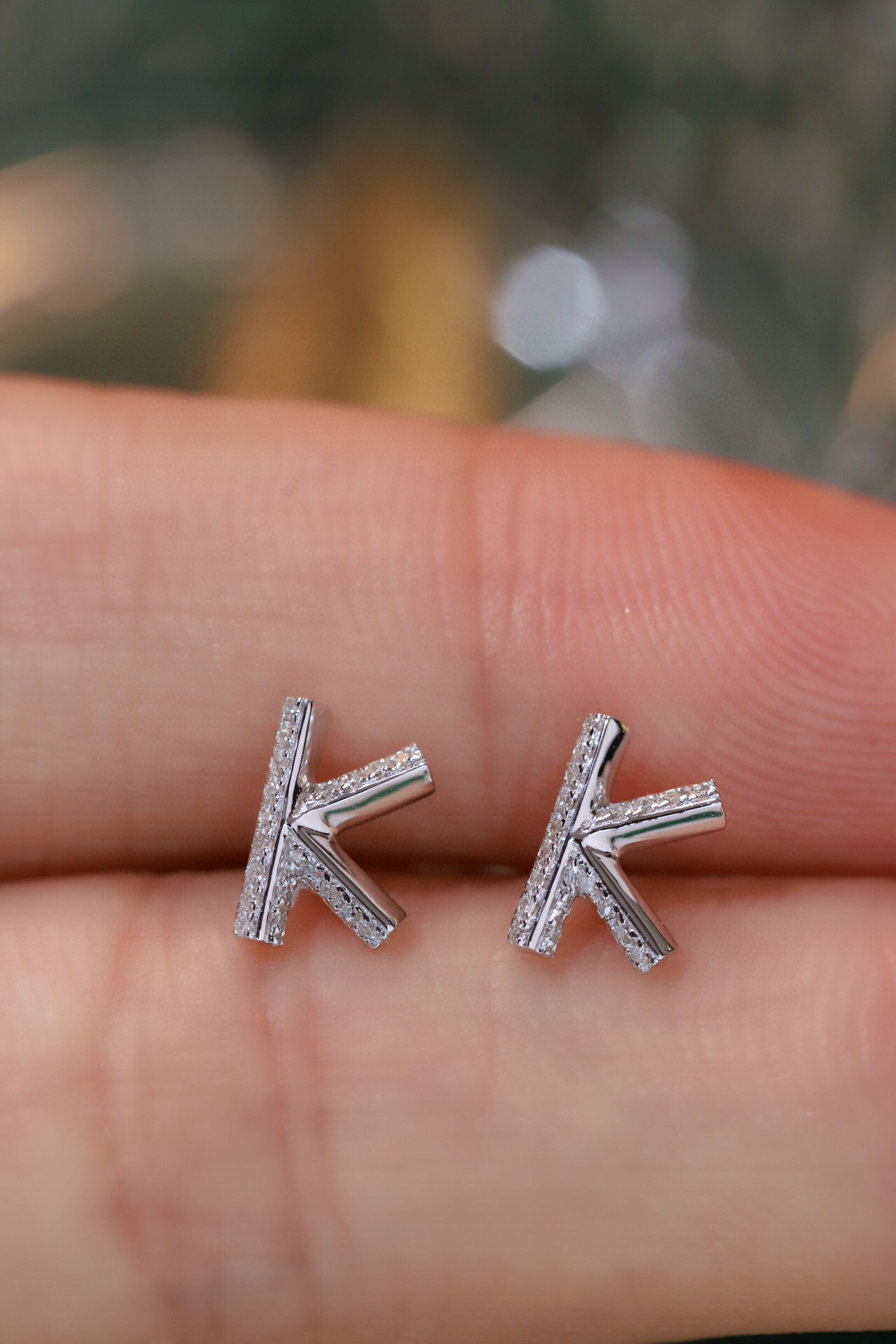 18k gold earring stud with the letter “K” and a 0.08ct natural diamond inlaid.