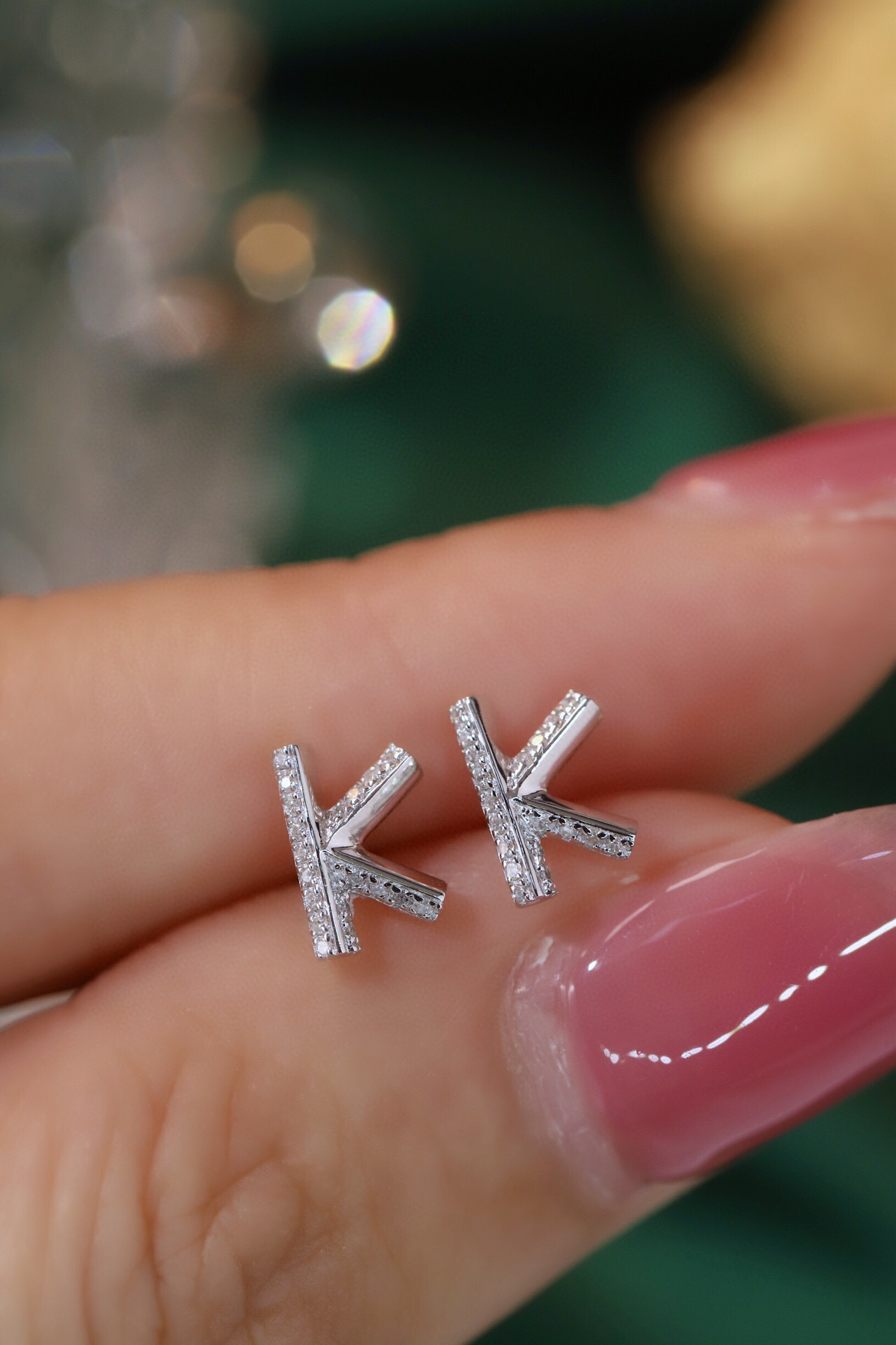 18k gold earring stud with the letter “K” and a 0.08ct natural diamond inlaid.