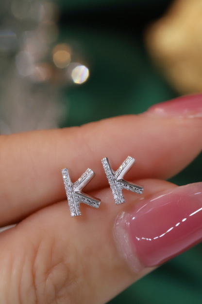 18k gold earring stud with the letter “K” and a 0.08ct natural diamond inlaid.