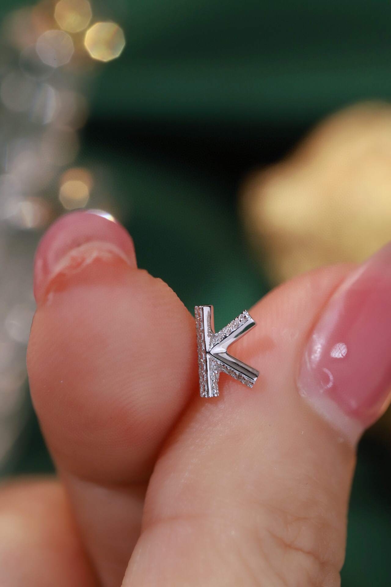 18k gold earring stud with the letter “K” and a 0.08ct natural diamond inlaid.