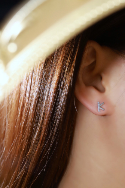 18k gold earring stud with the letter “K” and a 0.08ct natural diamond inlaid.
