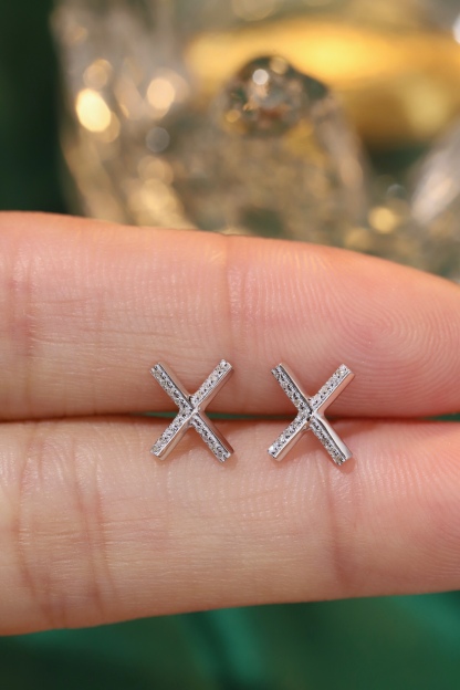 18k gold earring stud with the letter “X” and a 0.08ct natural diamond inlaid.