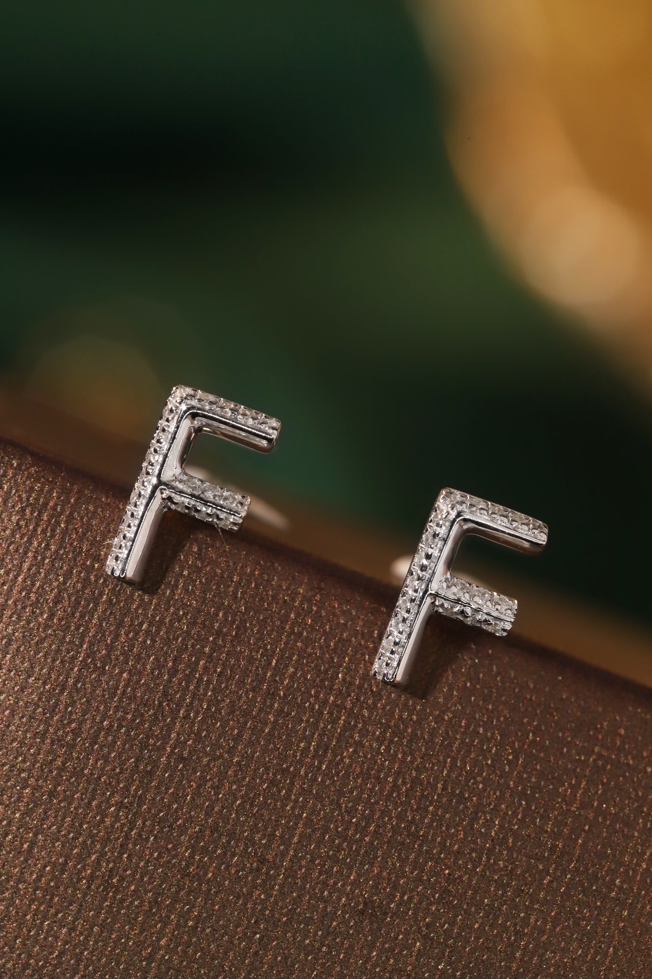 18k gold earring stud with the letter “F” and a 0.06ct natural diamond inlaid.