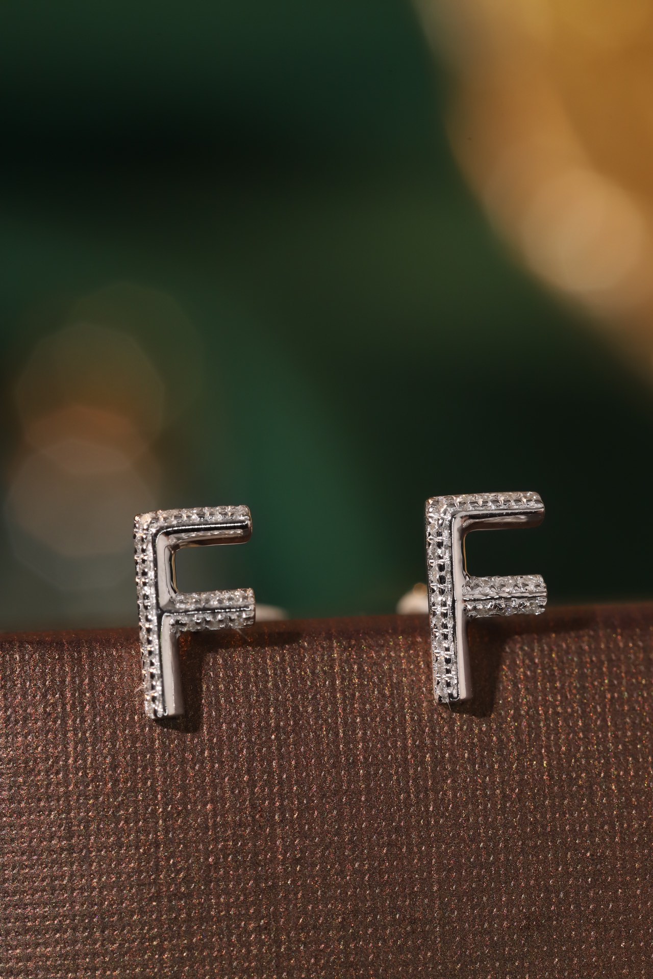 18k gold earring stud with the letter “F” and a 0.06ct natural diamond inlaid.