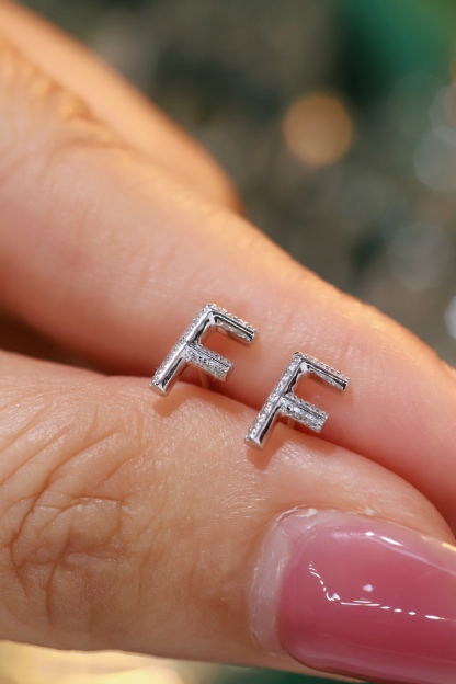 18k gold earring stud with the letter “F” and a 0.06ct natural diamond inlaid.
