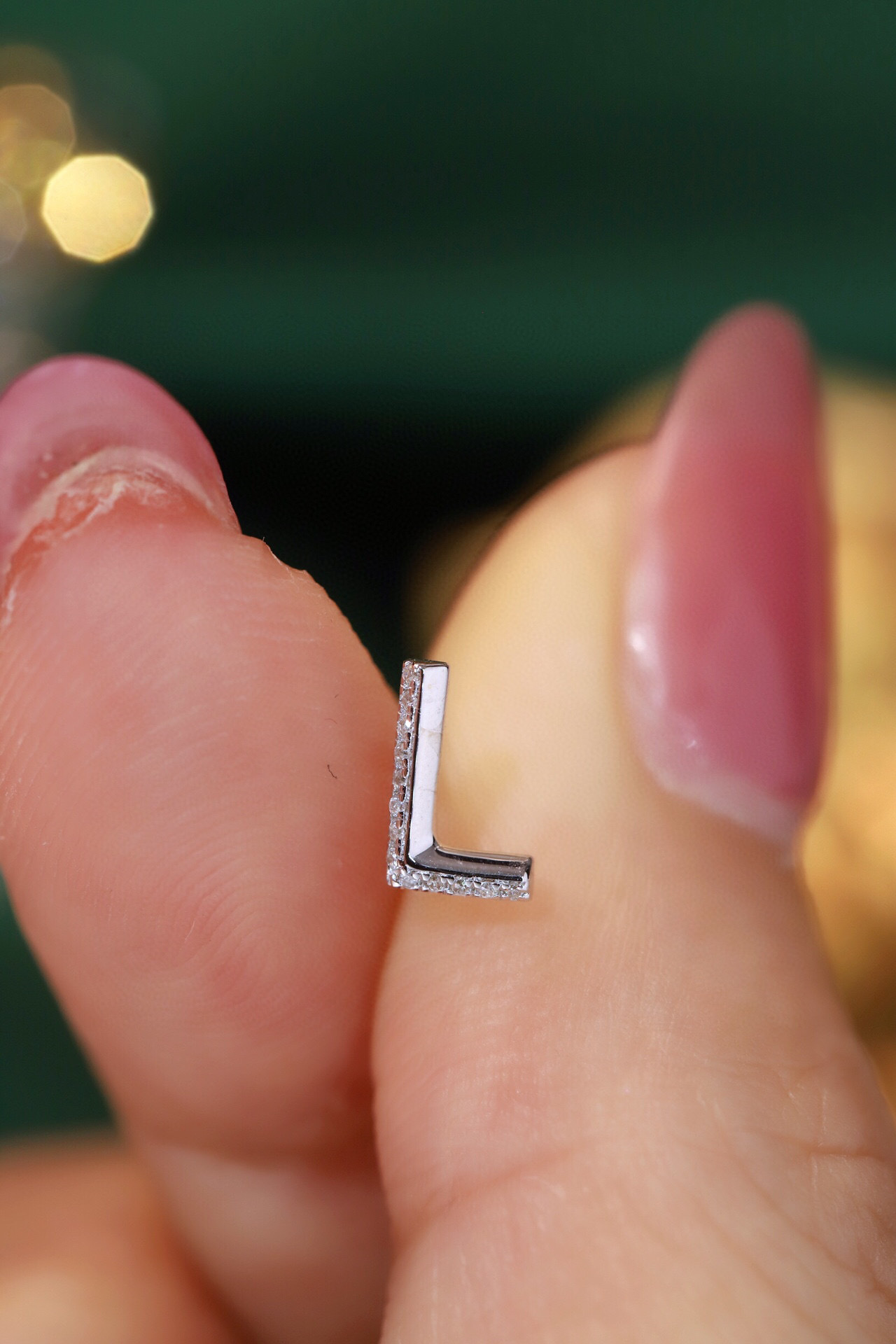 18k gold earring stud with the letter “L” and a 0.06ct natural diamond inlaid.