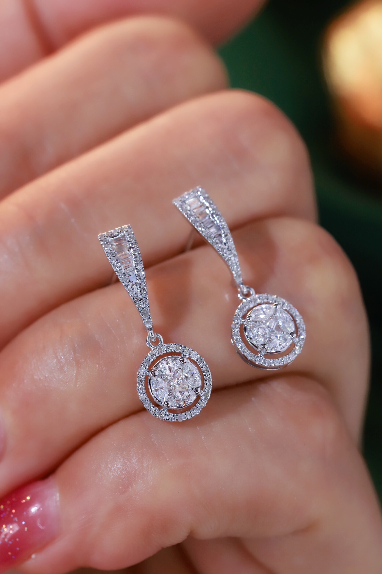 18k earrings set with a 0.60ct natural diamond; featuring a combination of marquise and princess cut diamonds.
