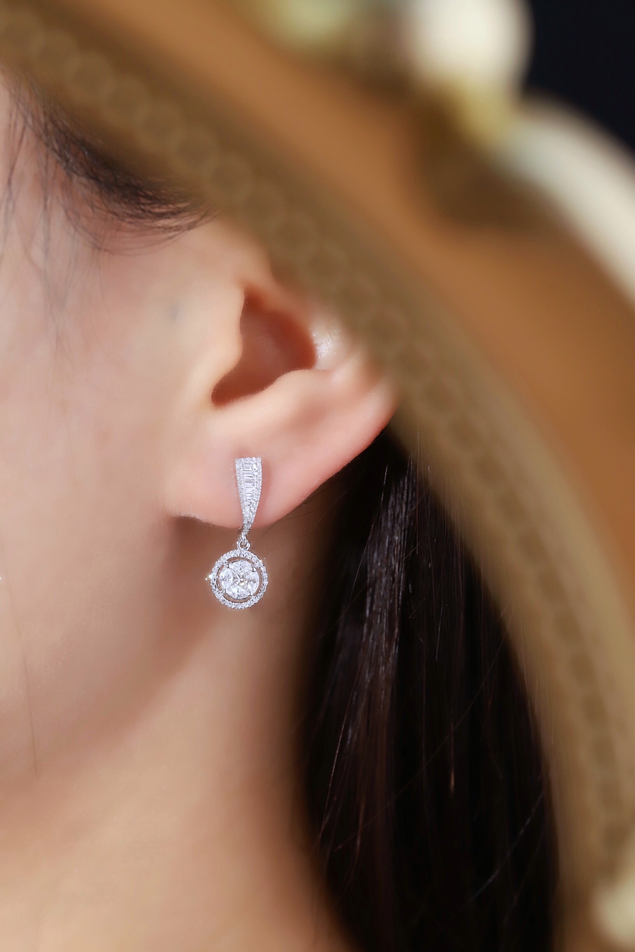 18k earrings set with a 0.60ct natural diamond; featuring a combination of marquise and princess cut diamonds.