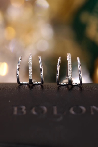 18k gold earrings set with a 0.12ct natural diamond