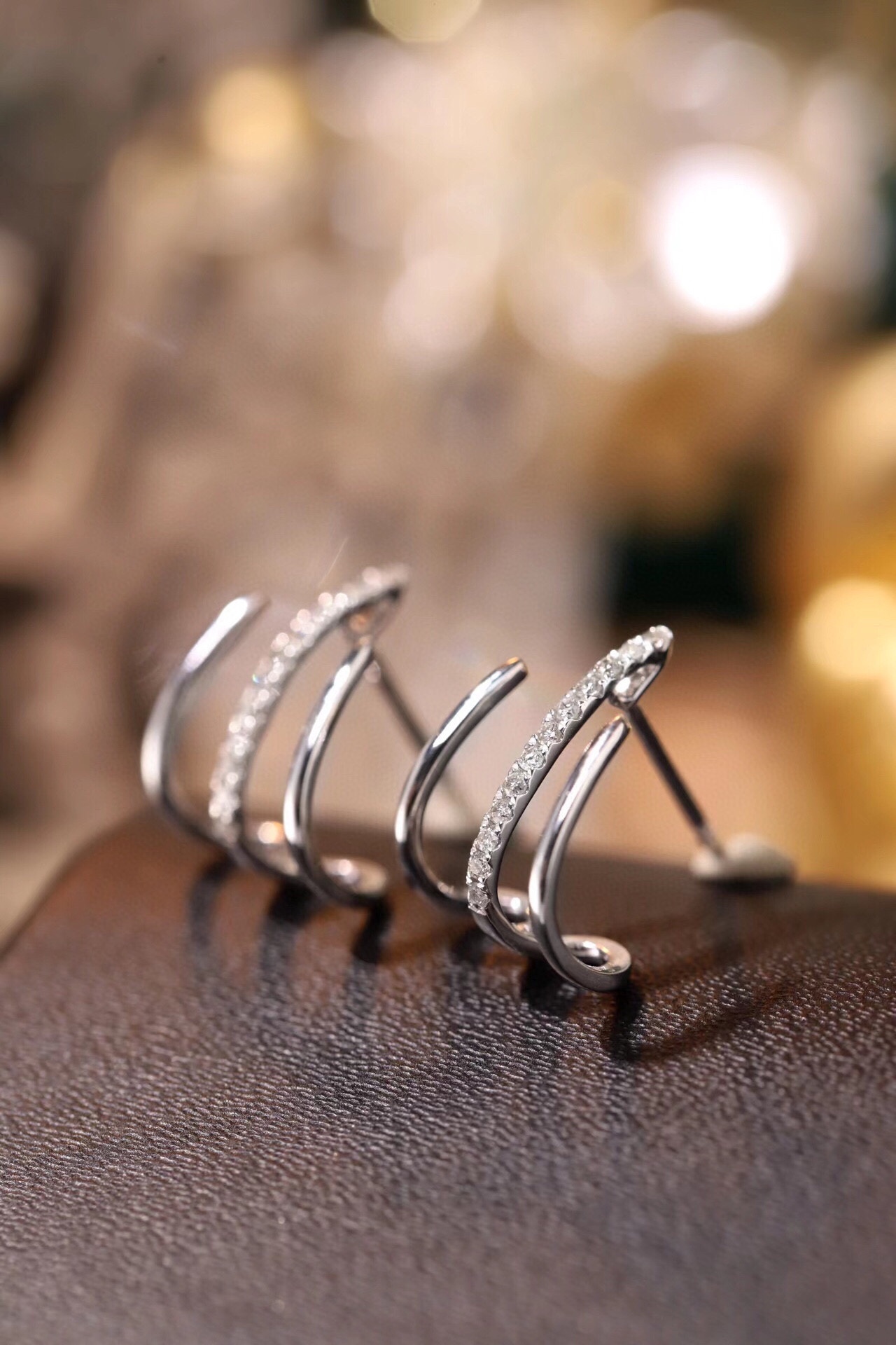 18k gold earrings set with a 0.12ct natural diamond