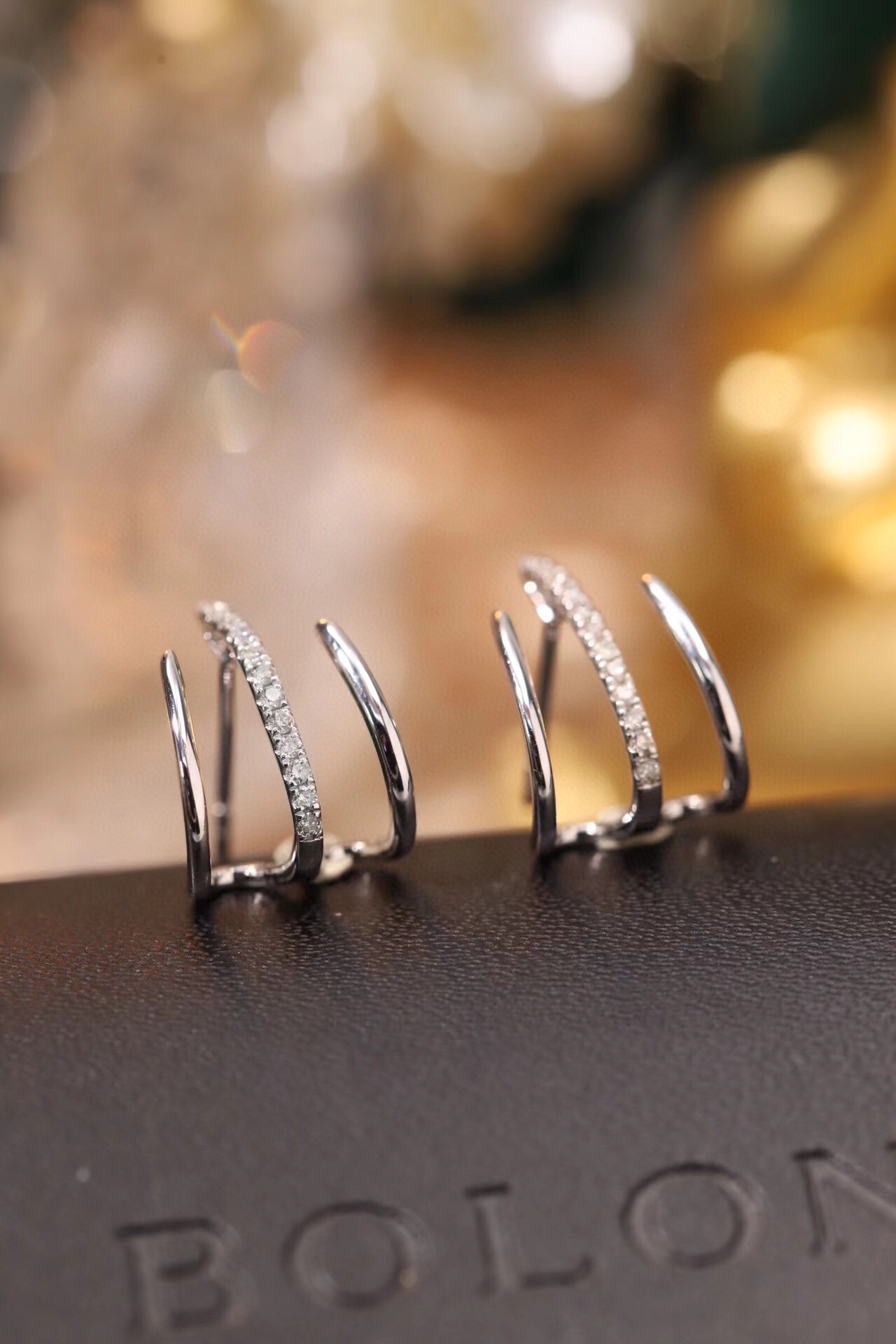 18k gold earrings set with a 0.12ct natural diamond