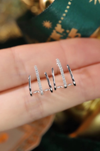 18k gold earrings set with a 0.12ct natural diamond