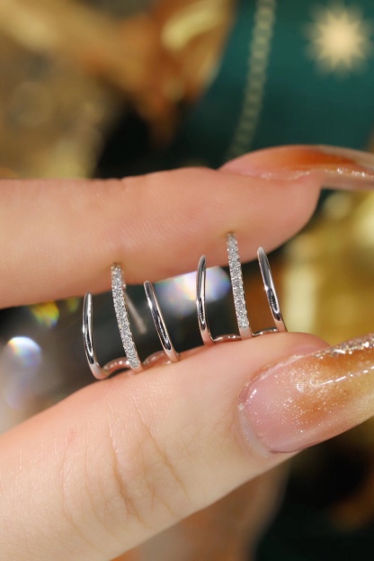 18k gold earrings set with a 0.12ct natural diamond