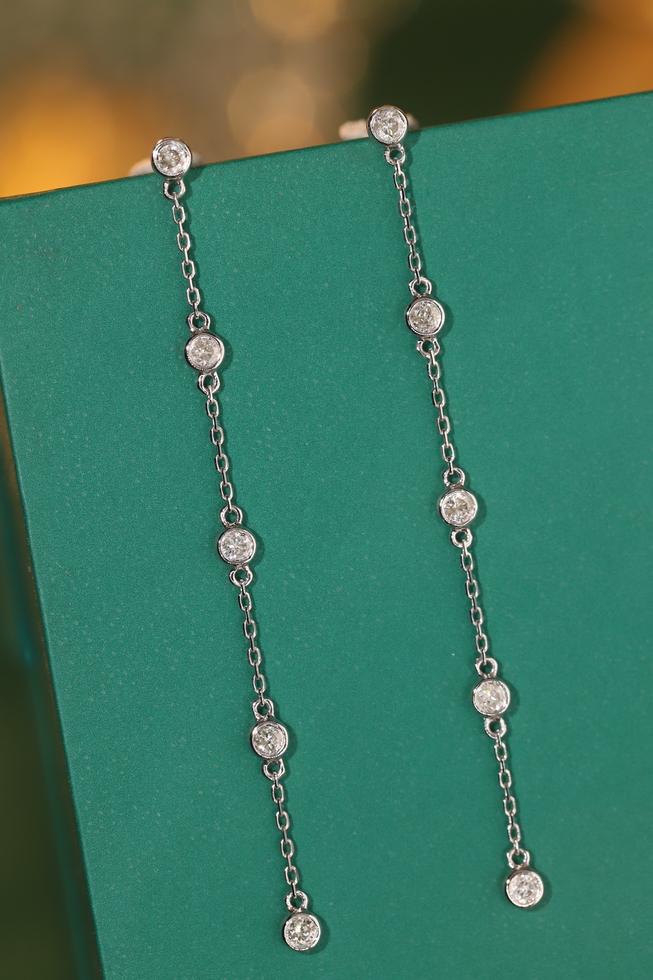 18k gold earrings with bezel setting, featuring a 0.30ct natural diamond.