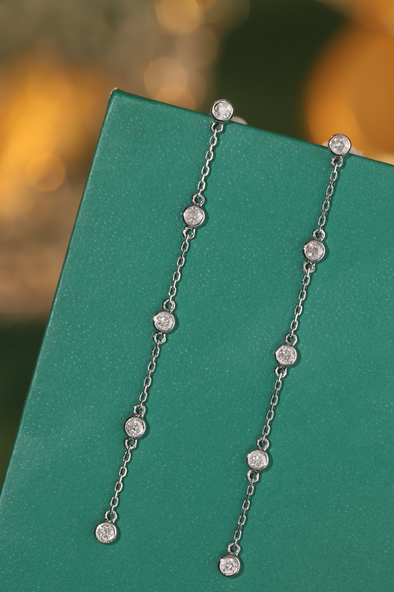 18k gold earrings with bezel setting, featuring a 0.30ct natural diamond.