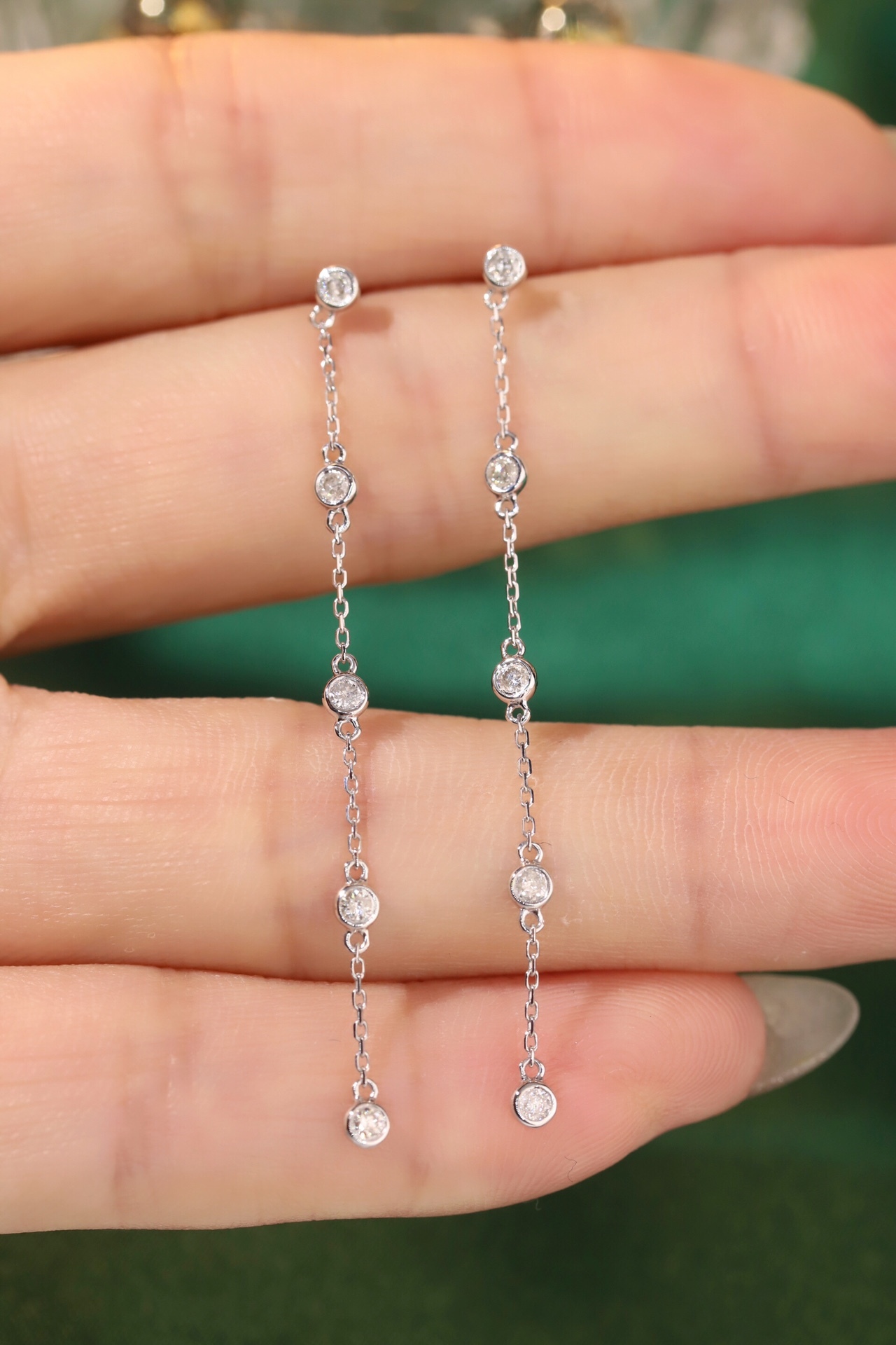 18k gold earrings with bezel setting, featuring a 0.30ct natural diamond.