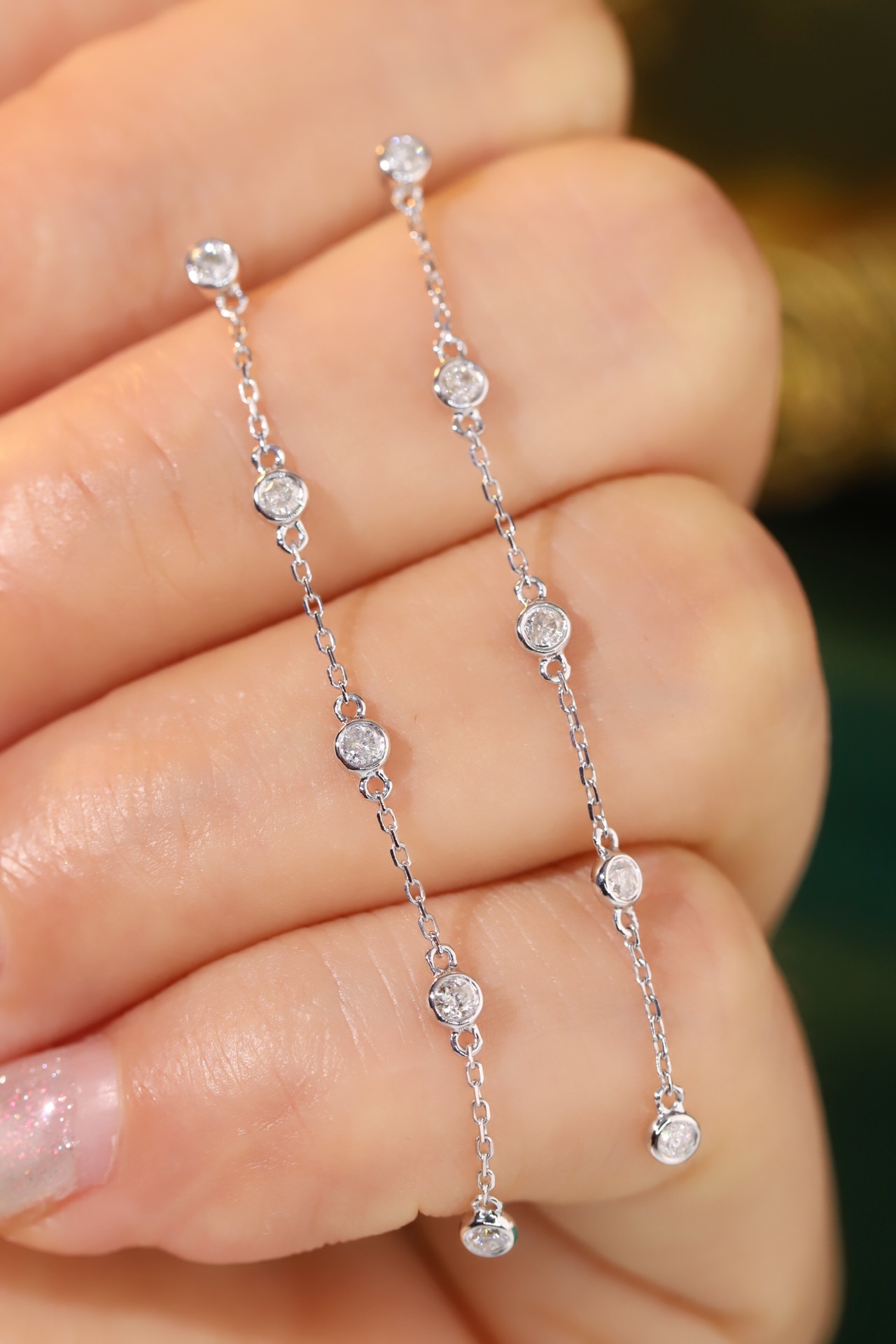 18k gold earrings with bezel setting, featuring a 0.30ct natural diamond.