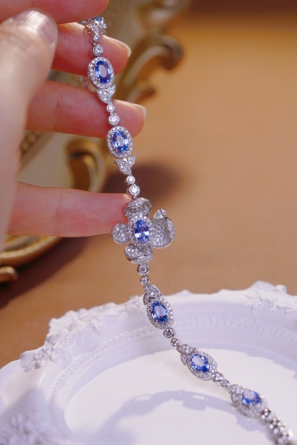 Flowers  18k Gold Bracelet with Luxuriously Set Sapphires and Diamonds totaling 5.70ct