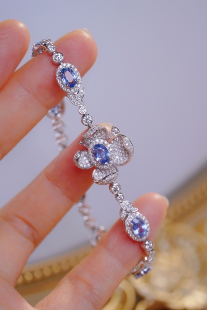Flowers  18k Gold Bracelet with Luxuriously Set Sapphires and Diamonds totaling 5.70ct