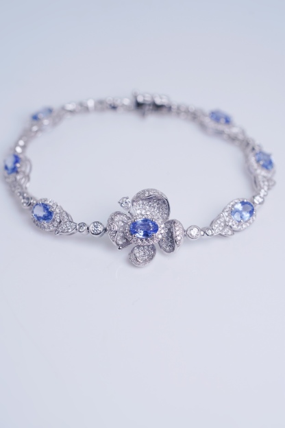 Flowers  18k Gold Bracelet with Luxuriously Set Sapphires and Diamonds totaling 5.70ct
