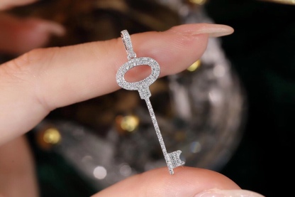 18k Gold Pendant in Key Shape, Inlaid with 0.25ct Natural Diamond (chain not included)