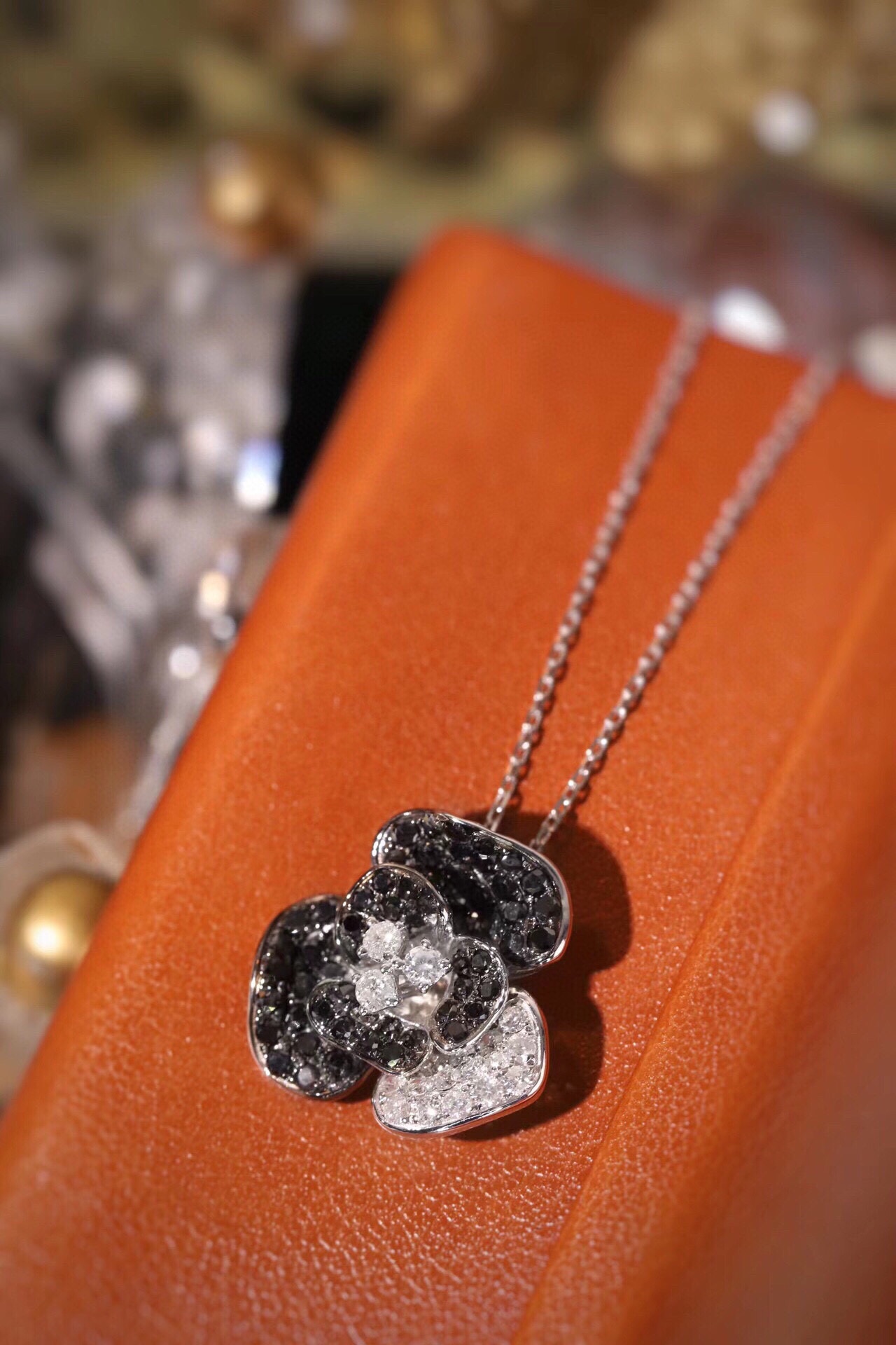18k Gold Necklace with Flower Design, featuring a combination of black and white diamonds