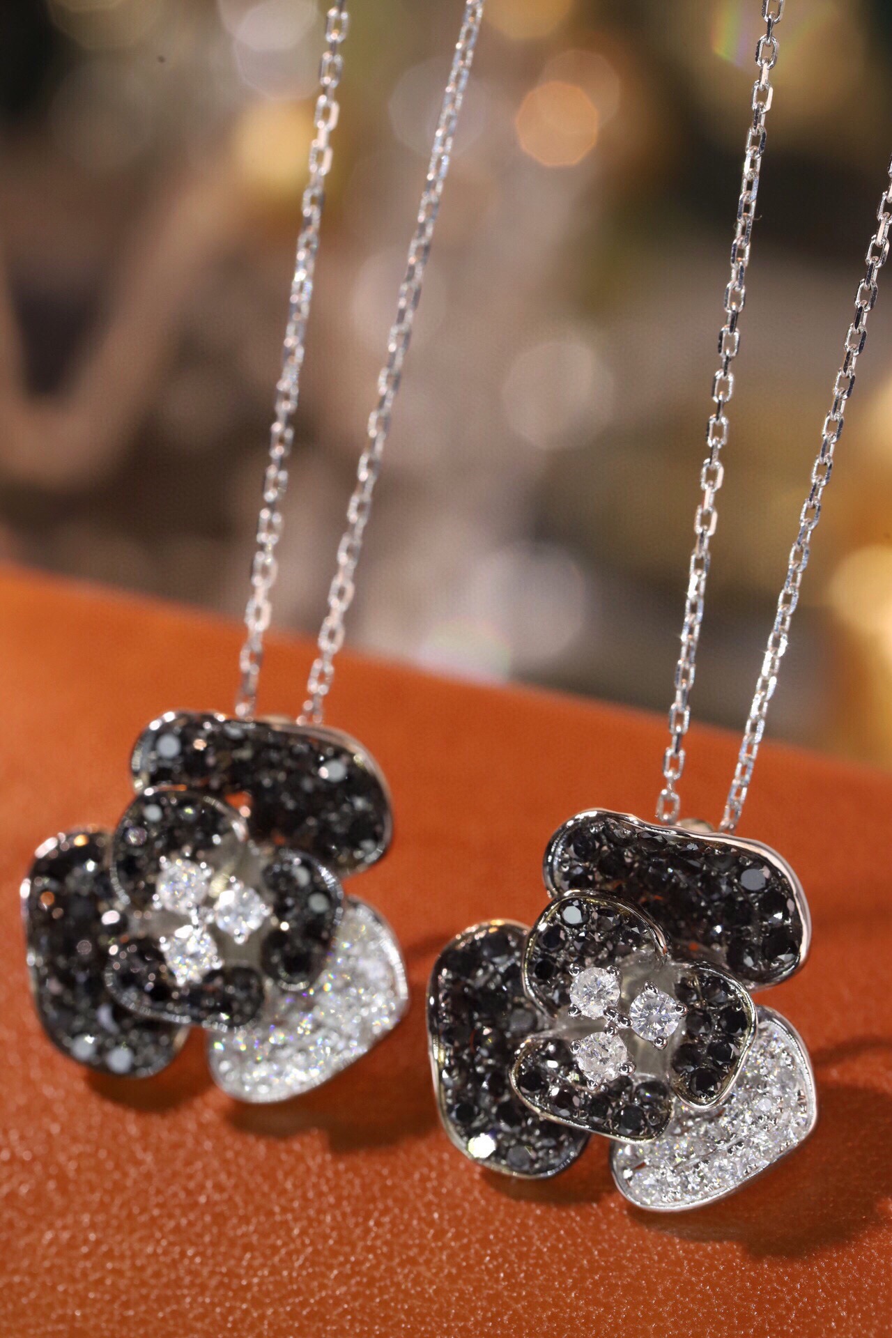 18k Gold Necklace with Flower Design, featuring a combination of black and white diamonds